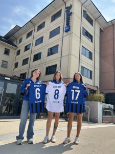 Athlone Town AFC Women's First Team showing team t-shirts in front of Radisson Blu Hotel Athlone